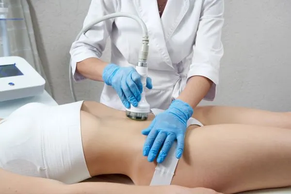 Lost the Weight but Not the Loose Skin? 2 woman having HIFU treatment on her stomach to combat loose skin Northwood following weight loss